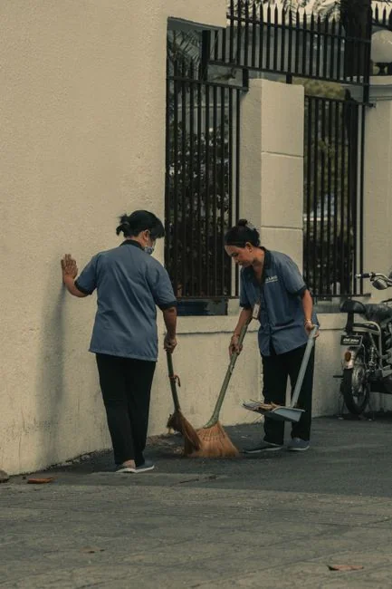 creative-02 Man cleans floor at an entrance door.